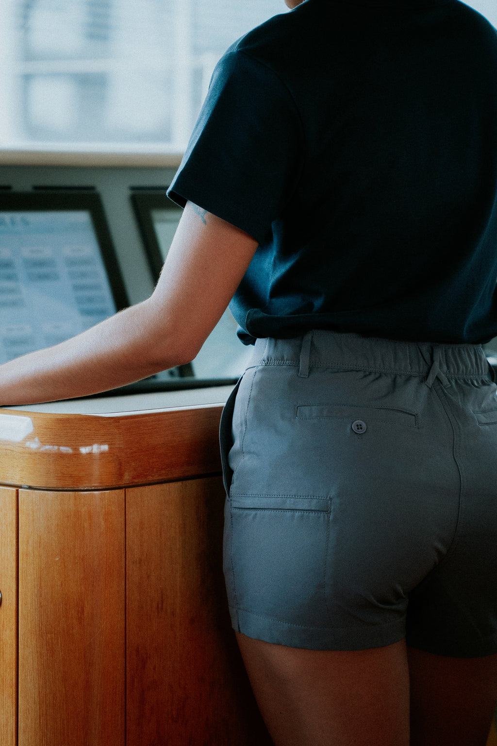 Women wearing grey chino deck shorts. Women's deck shorts. Yachtwear, workwear