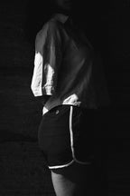 Woman wearing board shorts / running shorts. Yachtwear. Women's deck shorts.