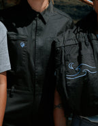 Woman in black boiler suit / coveralls. Workwear, streetwear. Workwear style