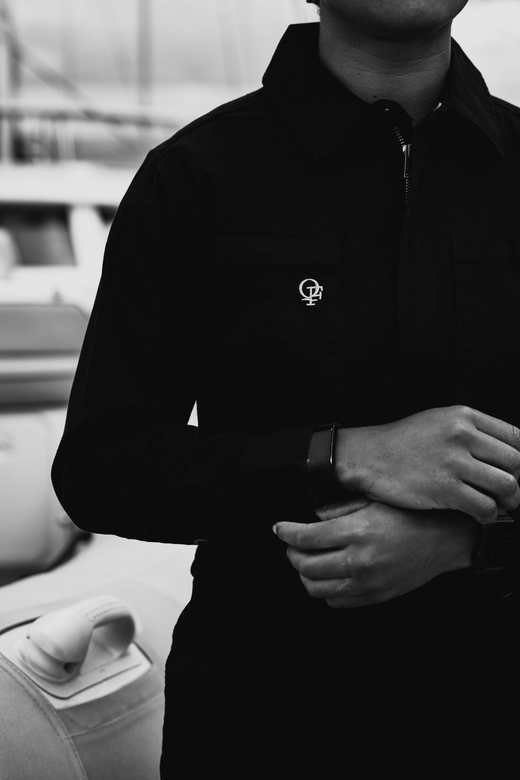 Woman in black boiler suit / coveralls. Workwear, streetwear. Workwear style