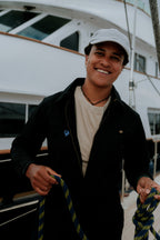 Woman in black boiler suit / coveralls. Workwear, streetwear. Workwear style