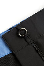 Close-up of a black chino deck shorts with a blue trim on a white background. Women's deck shorts. Yachtwear, workwear