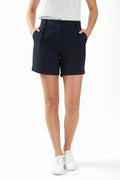 Person wearing navy chino deck shorts on a white background. Women's deck short. Yachtwear, workwear