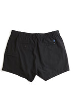 black chino shorts on a white background. Women's deck shorts. Yachtwear, workwear