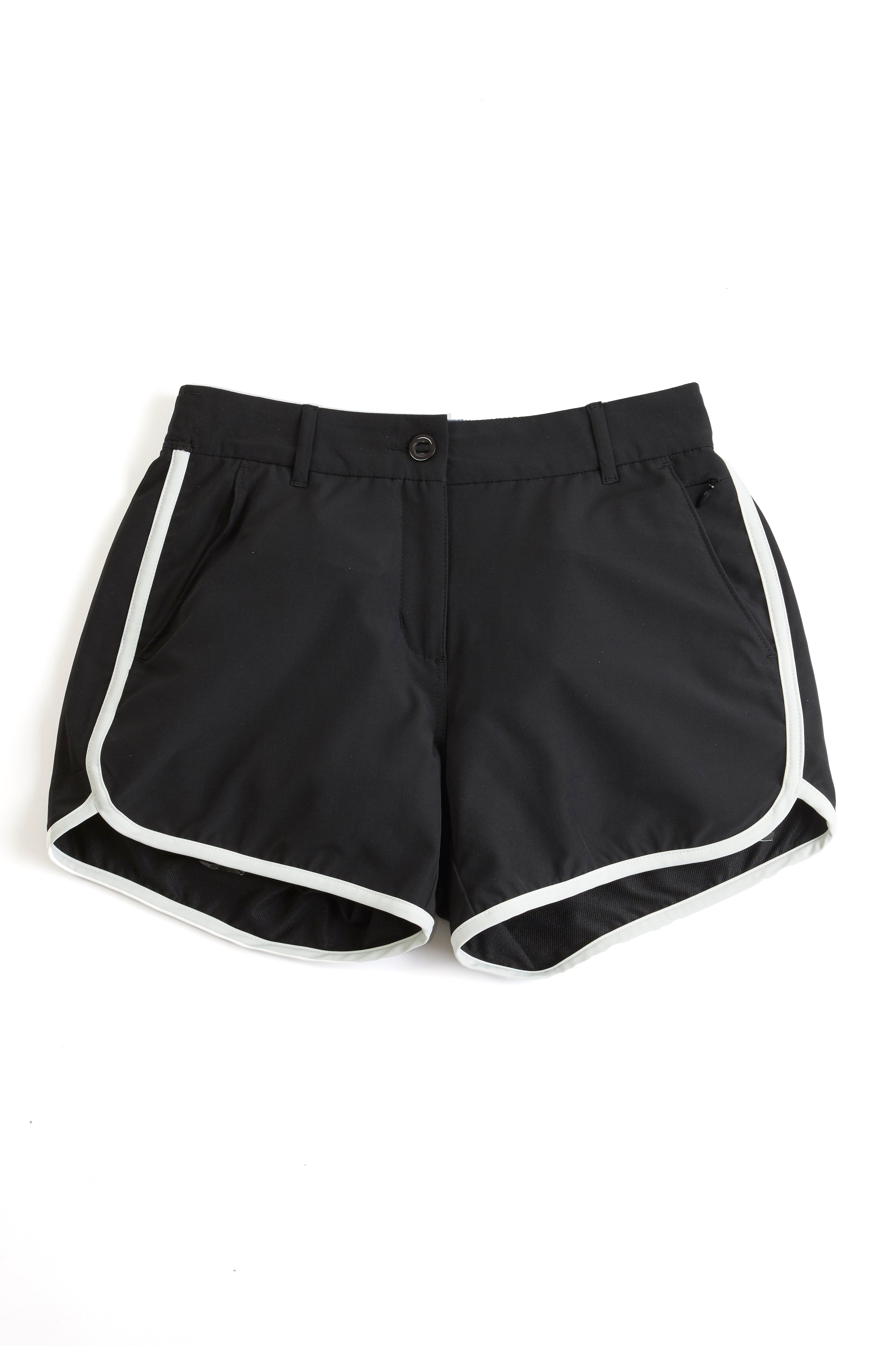 Black shorts with white trim on a white background. black shorts on a white background. Women's deck shorts. Yachtwear, workwear
