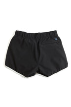 Black shorts with a brand logo on a white background. black shorts on a white background. Women's deck shorts. Yachtwear, workwear