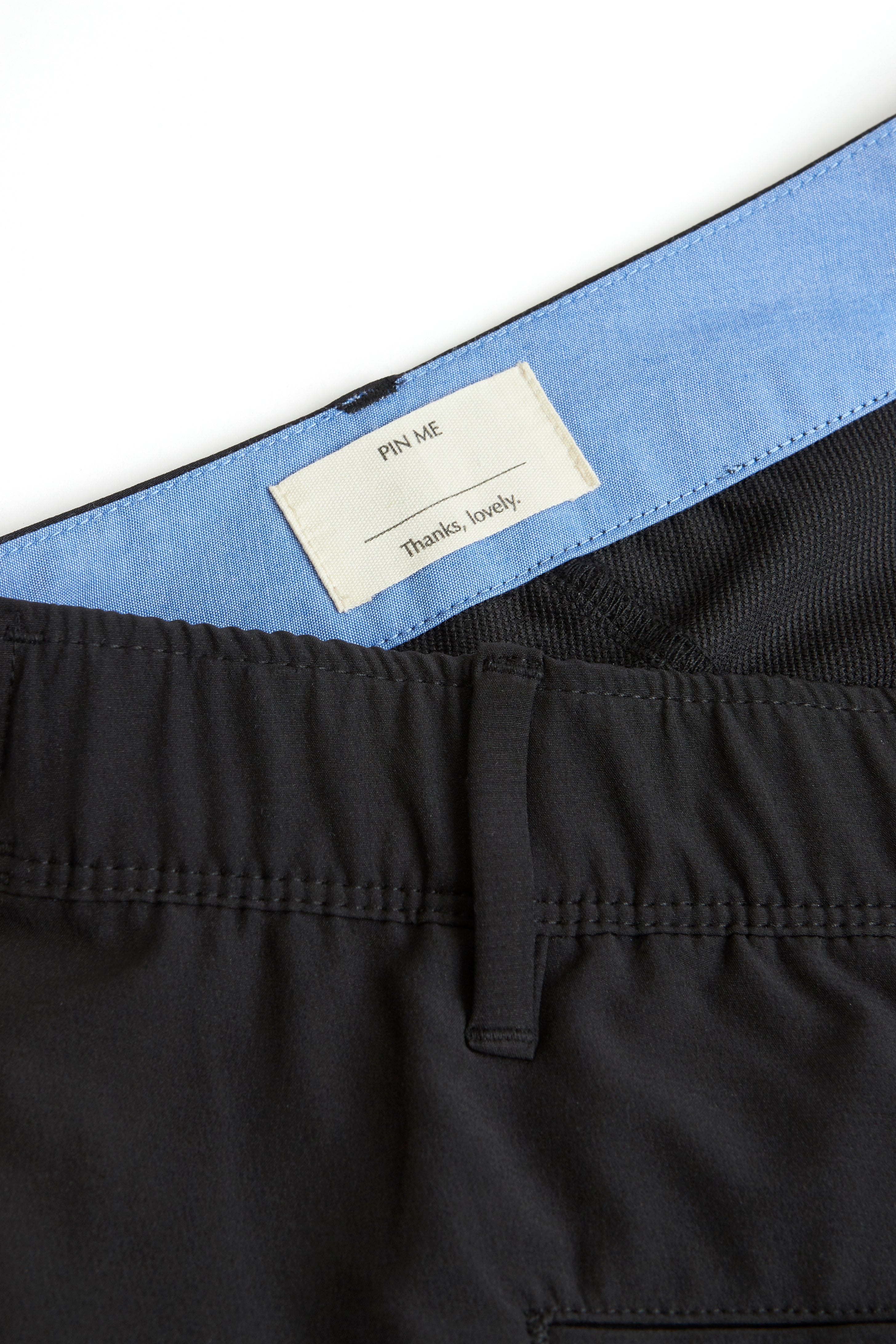 black chino shorts on a white background. Women's deck shorts. Yachtwear, workwear