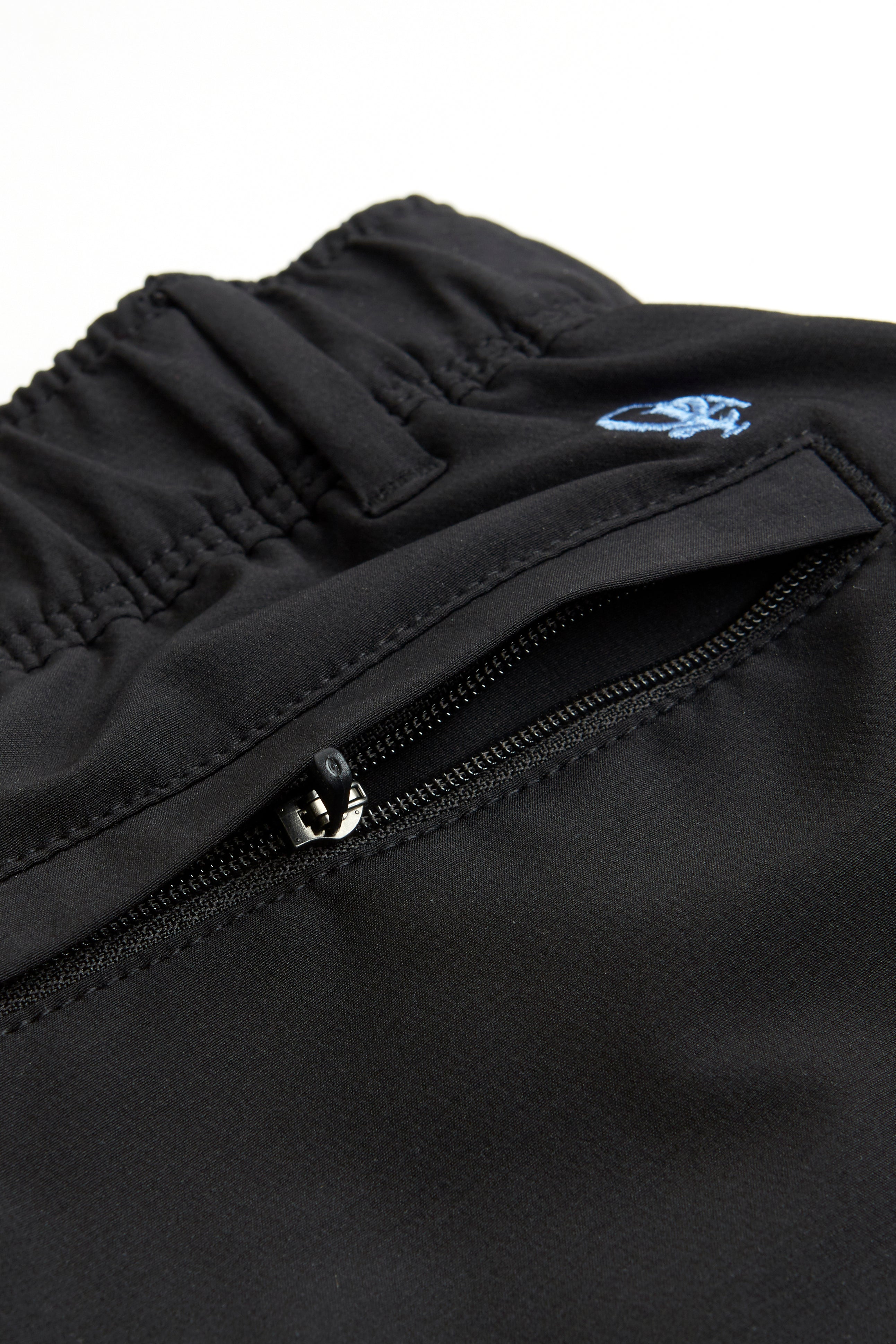 black chino shorts on a white background. Women's deck shorts. Yachtwear, workwear