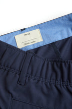 navy chino shorts on a white background. Women's deck shorts. Yachtwear, workwear