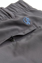 Gray pants with a blue logo on the pocket against a white background. grey chino deck shorts. Women's deck shorts. Yachtwear, workwear