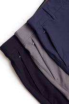 Three pairs of chino deck shorts in black, gray, and navy on a white background. Women's deck shorts. Yachtwear, workwear. WOmen's deck shorts