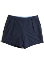 Navy blue chino shorts on a white background. Yachtwear. Women's deck shorts. 