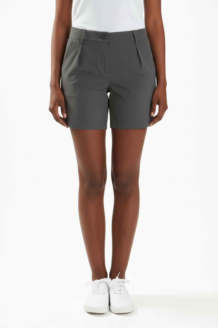 Person wearing grey chino shorts on a white background. Yachtwear. Women's deck shorts. 